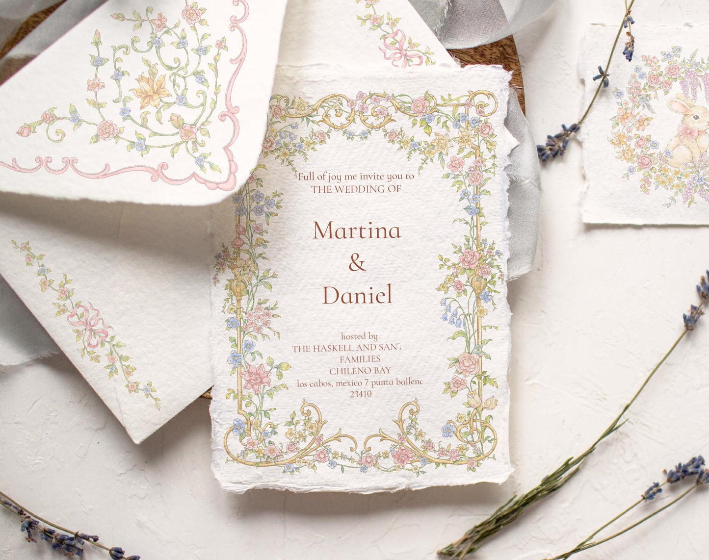 Wedding invitation suite framed with Floral Basket floral border and pastel ribbon