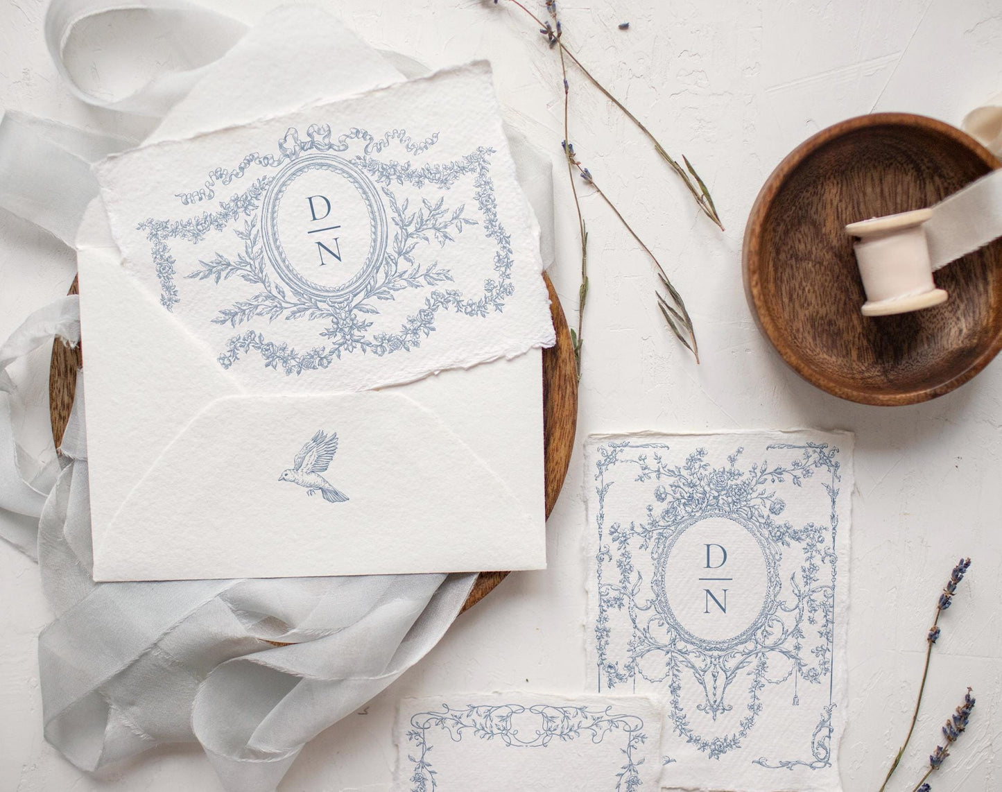 Invitation suite framed with Ornate Baroque blue oval crest and swag border