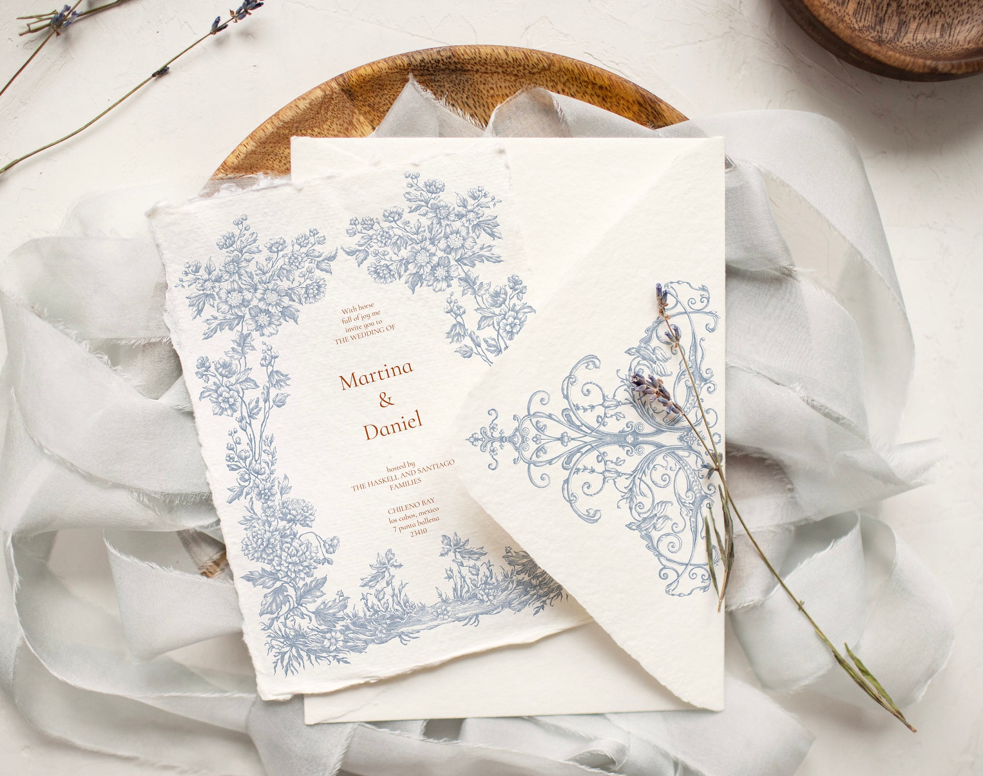 Invitation card and envelope showing Floral Aesthetics border and corner flourish