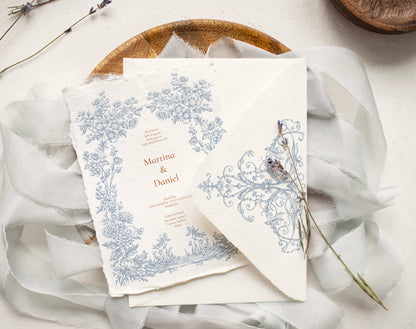 Invitation card and envelope showing Floral Aesthetics border and corner flourish