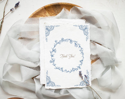 Wedding invitation card framed with Lovely Garden Blue floral border