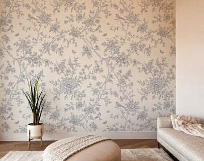 Room interior with floral wallpaper, plant, and sofa