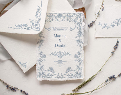 Wedding invitation mockup featuring a delicate blue floral frame from the Fleur D’Amour line art collection.