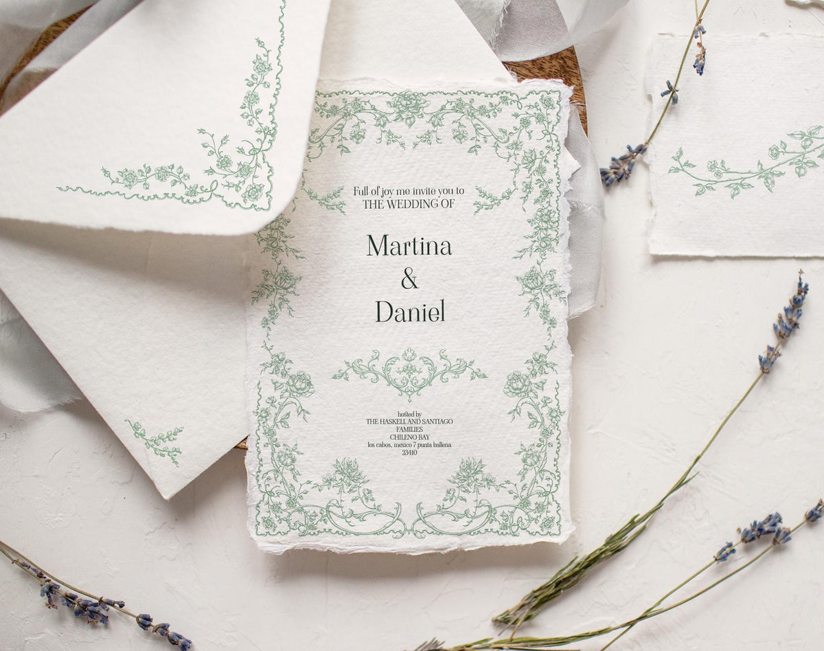 Wedding invitation mockup decorated with a delicate green Fleur D’Amour floral frame on textured paper.