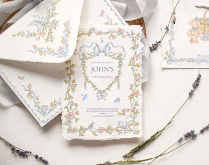 Styled stationery mockup featuring Little Bear floral border artwork, blue ribbons, and a teddy bear motif.