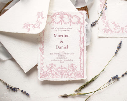 Pink Rococo floral frame shown as a wedding invitation design on textured paper with lavender sprigs.